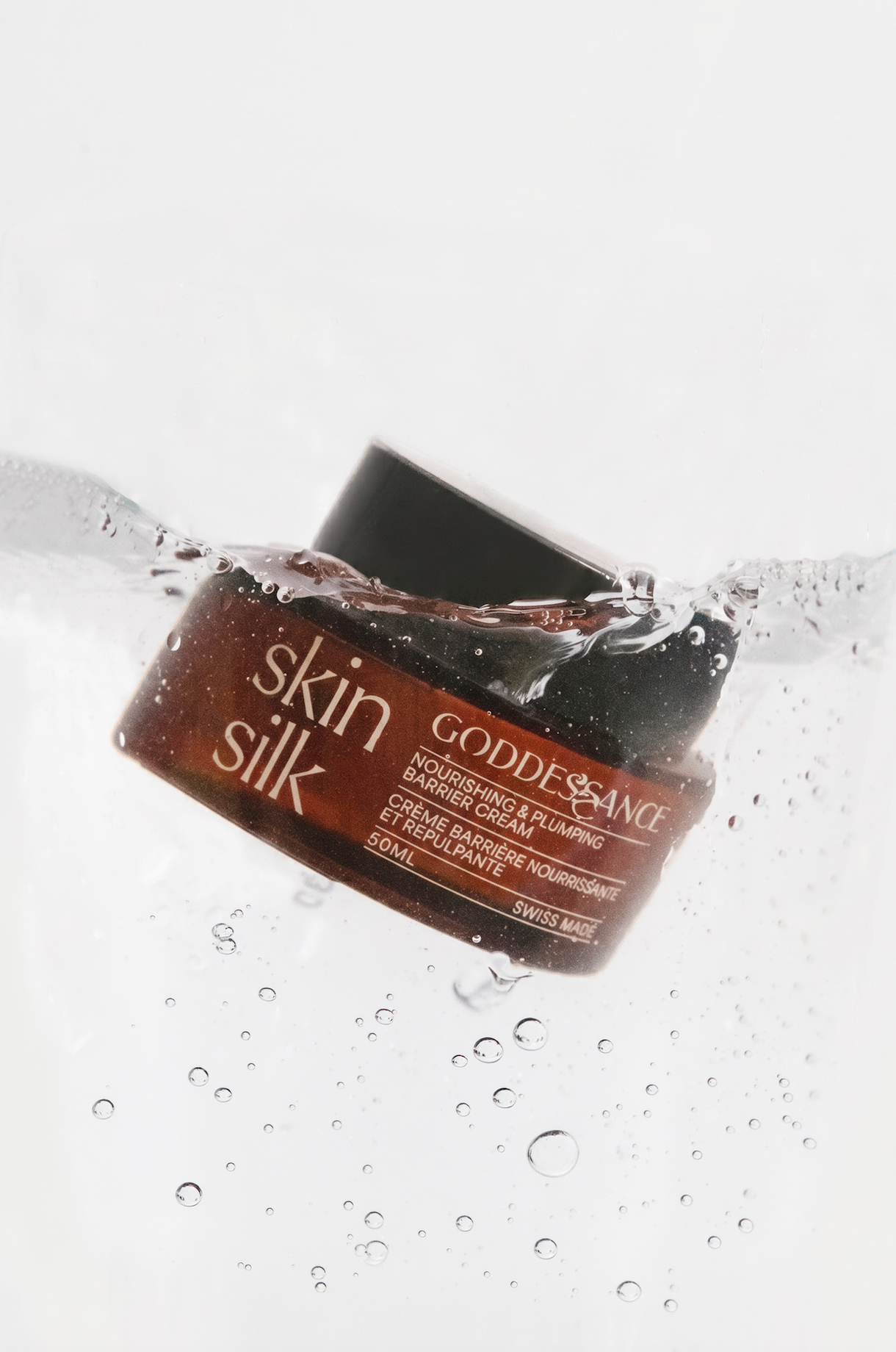 Skin Silk jar splashing into water
